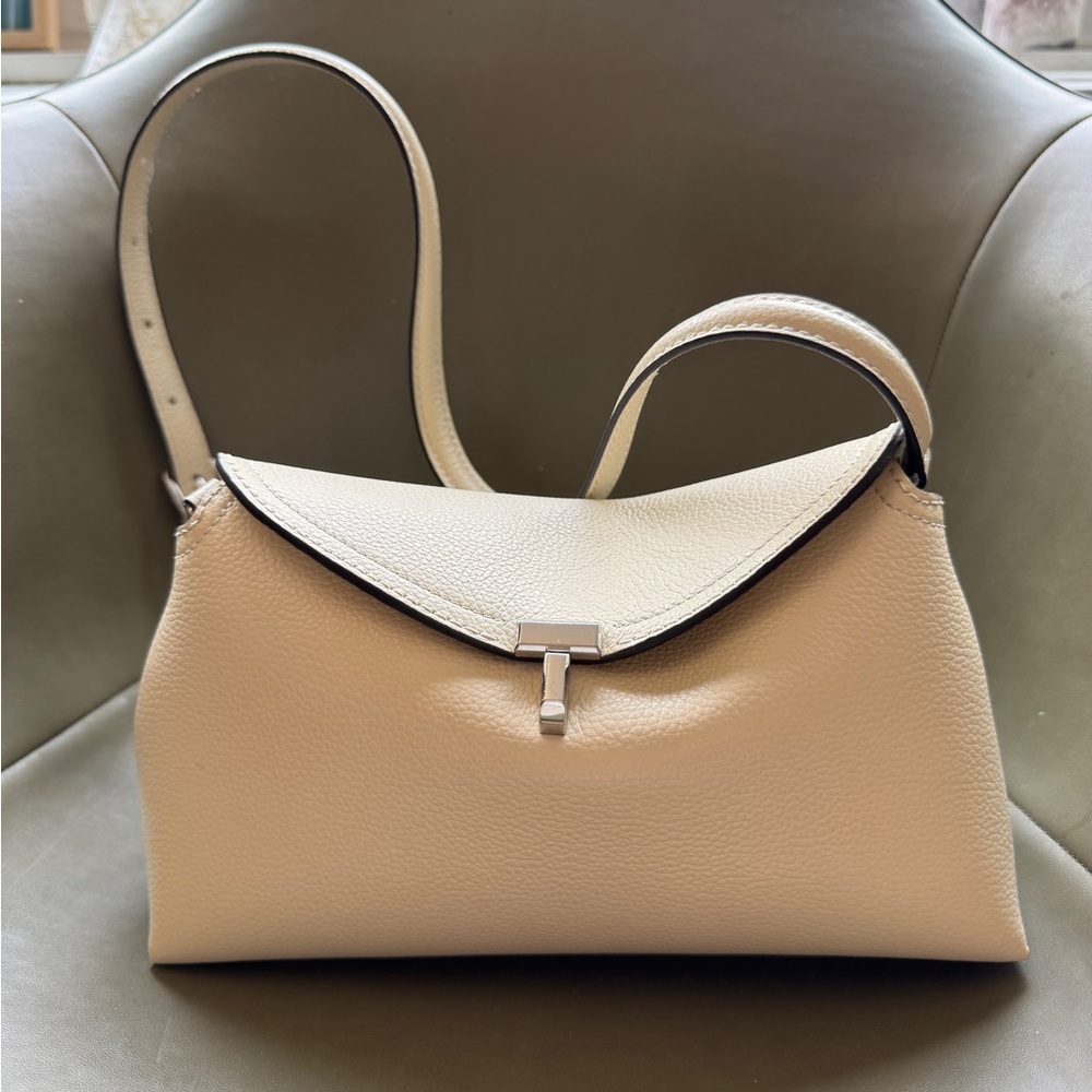 NWOT Toteme T-Lock leather bag/clutch in color milk